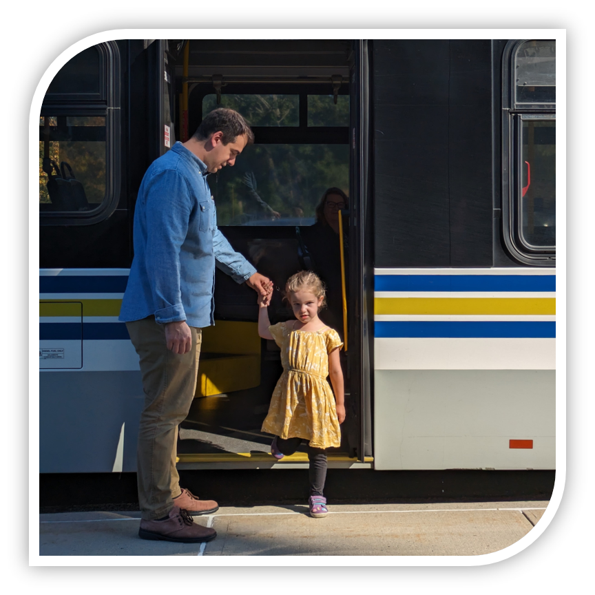 a father and child riding a bus